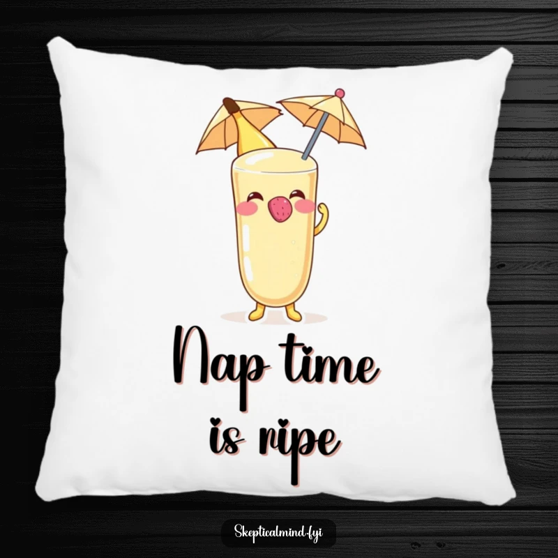 Funny Banana smoothie character blowing a raspberry on a tiny umbrella, depicted on a soft, decorative pillow.