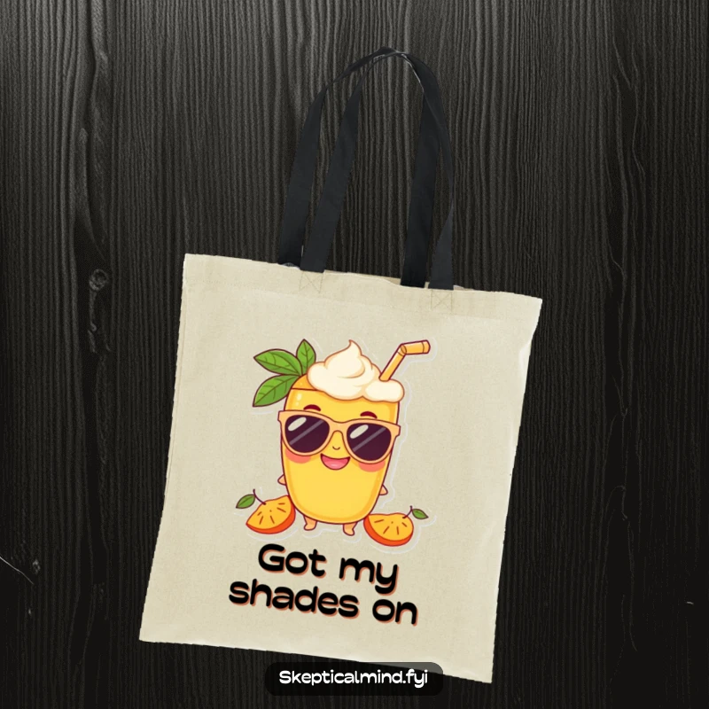 Funny Mango smoothie character in oversized sunglasses with a grin, printed on a fashionable tote bag.